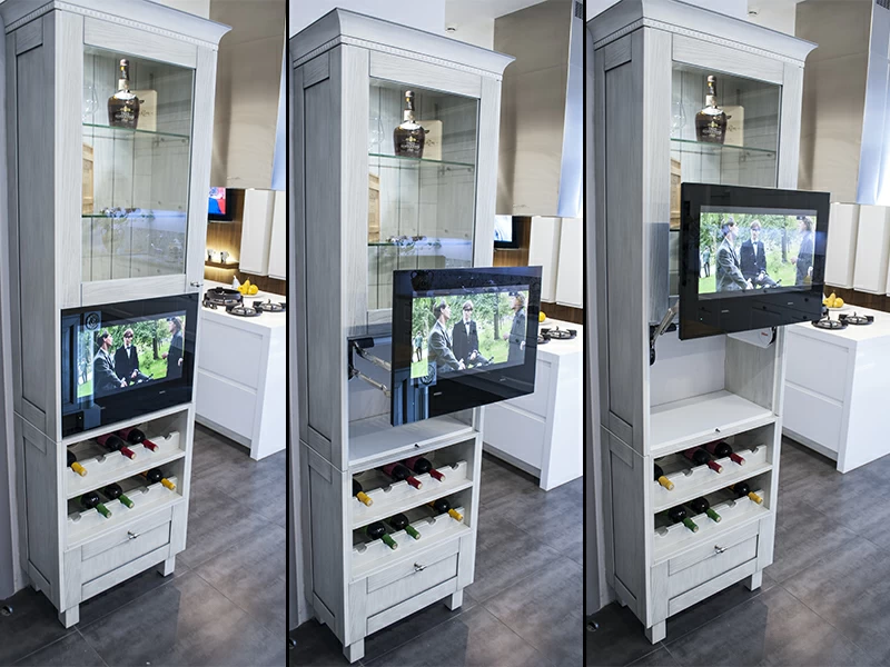 Kitchen TV lift systems demonstrated in a white cabinet