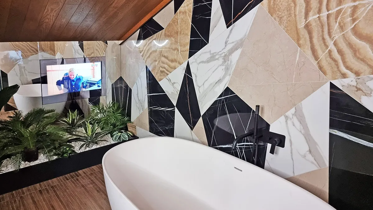AVEL TV in a bathroom with a freestanding bathtub
