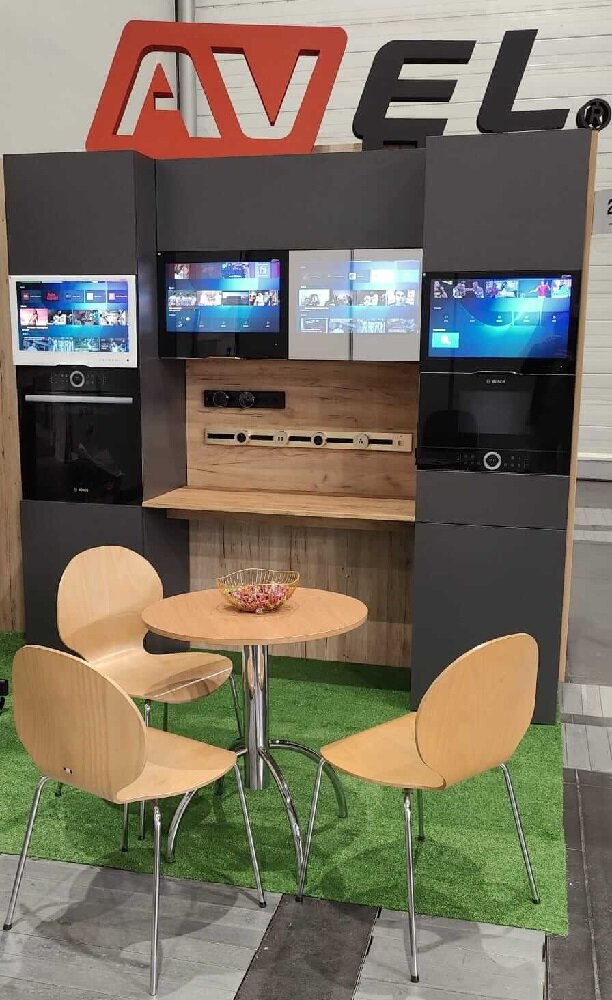 AVEL booth with kitchen TVs at a furniture exhibition in Poland