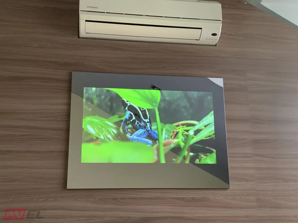 AVEL mirrored TV showing a picture