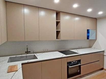 Beige kitchen with an AVEL mirror TV in the upper cabinet