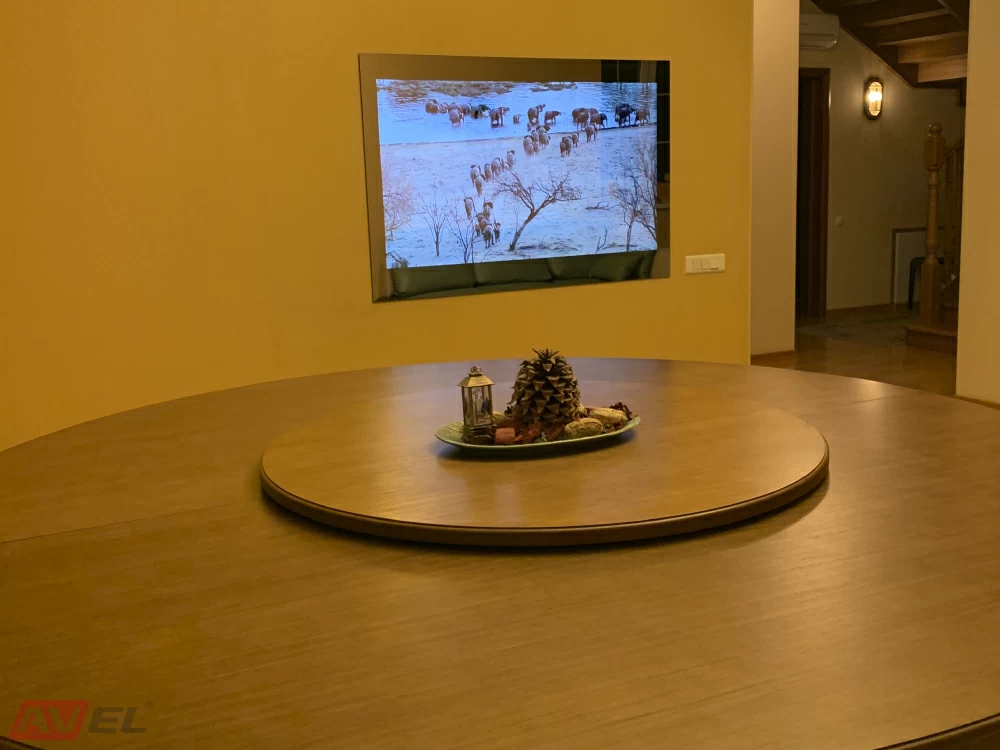 AVEL mirror TV on a dining room wall