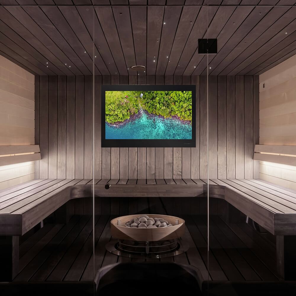 Waterproof TV on the wall of a modern sauna