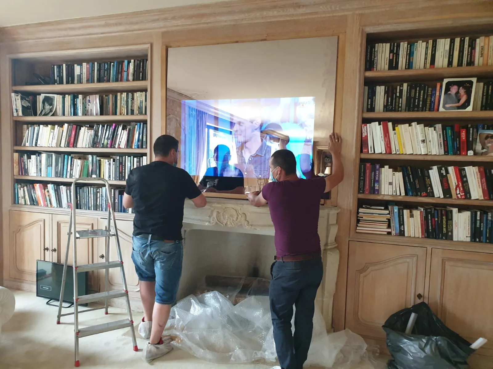Installing a custom magic mirror TV above a fireplace