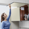 Opening a kitchen cabinet with the DTC TOP-STAYS SF lift system