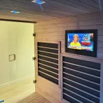 Waterproof AVEL TV built into a wooden sauna wall
