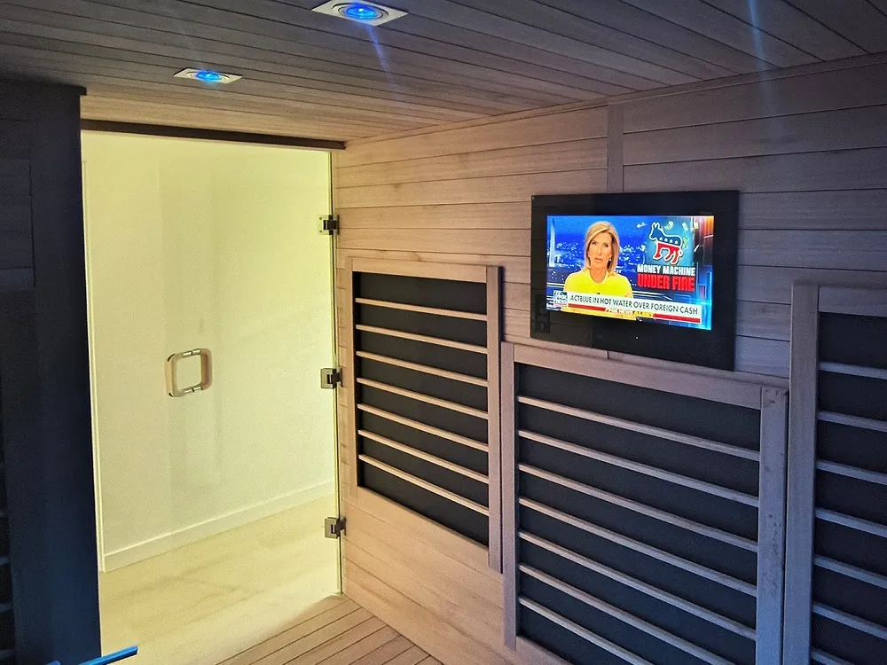 Waterproof AVEL TV built into a wooden sauna wall