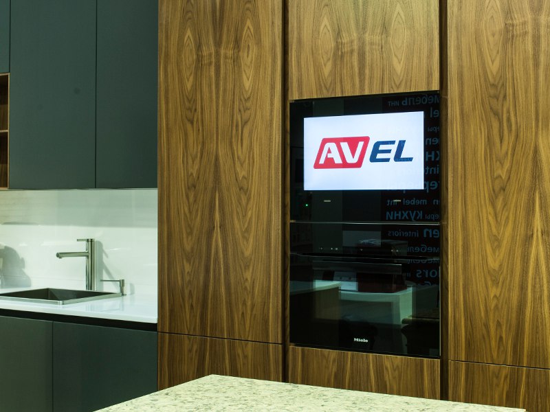 AVEL TV built into a walnut kitchen column