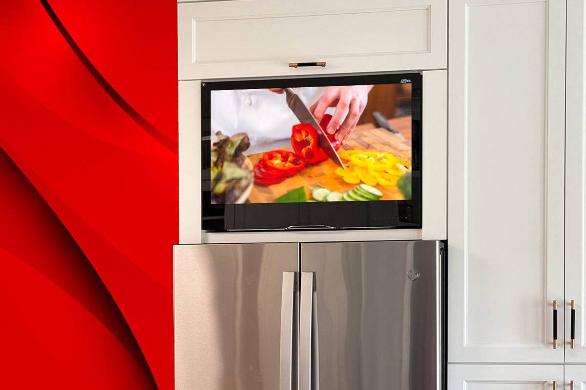 AVEL TV above a refrigerator in a white kitchen