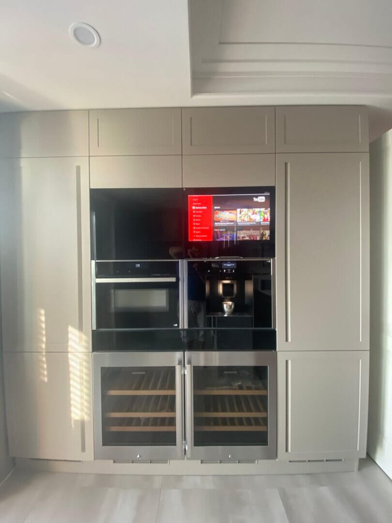 AVEL TV in a built-in appliance column with wine coolers