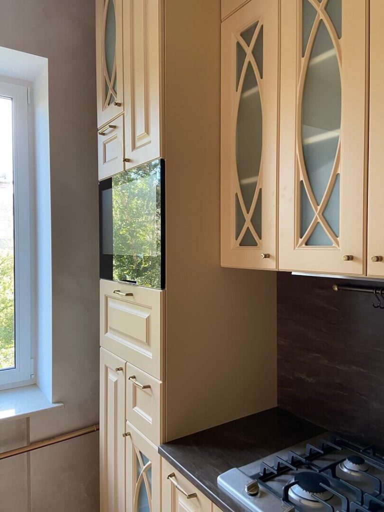 AVEL TV in a cream kitchen next to a window