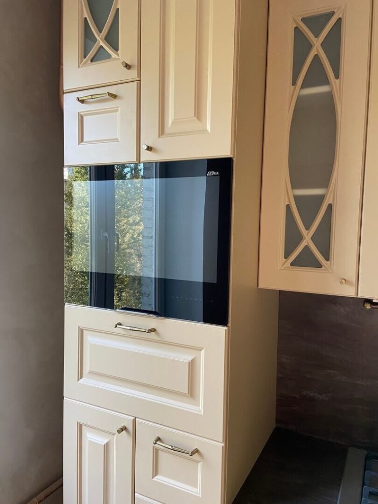 AVEL mirror TV in a classic cream kitchen cabinet